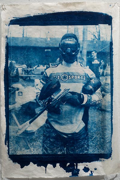 Image: Accra Shepp, Josh with Helmet and Gun